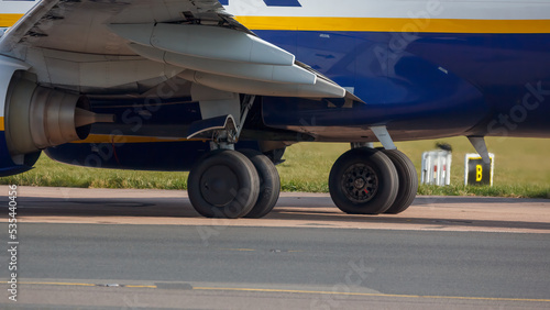 G-RUKE at Manchester Airport view of undercarriage of aircraft - stock photo photo