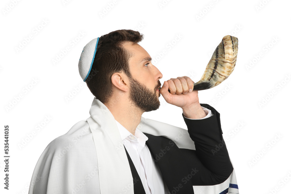 Jewish man with kippah and tallit blowing shofar on white background. Rosh Hashanah celebration Jewish man with kippah and tallit blowing shofar on white background. Rosh Hashanah celebration