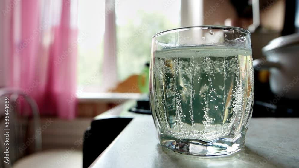 healthy eating, diet and drinks concept
a man takes a glass with a dissolved headache pill or vitamin C from the kitchen table and sits by the window to drink it healthy eating, diet and drinks concept
a man takes a glass with a dissolved headache pill or vitamin C from the kitchen table and sits by the window to drink it