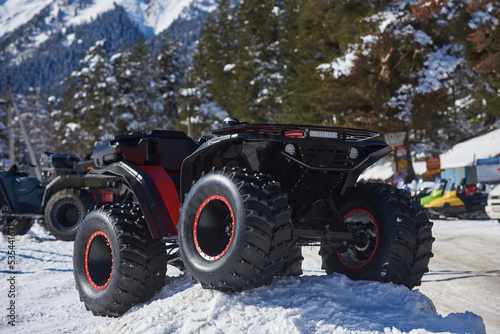 Quadbike with big wheels on the snow