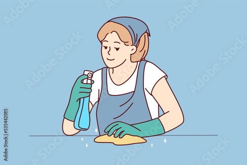 Female housekeeper with detergent and cloth working cleaning surface. Housewife take care of house cleanliness. Housekeeping and hygiene. Vector illustration. 