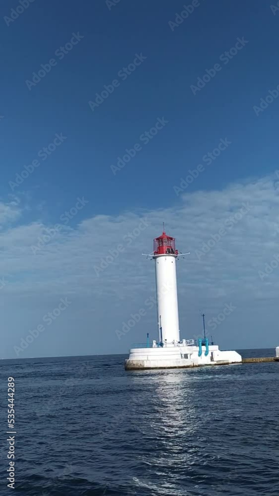 view of the sea lighthouse from a moving ship vertical frame
seascape with lighthouse camera movement view of the sea lighthouse from a moving ship vertical frame
seascape with lighthouse camera movement