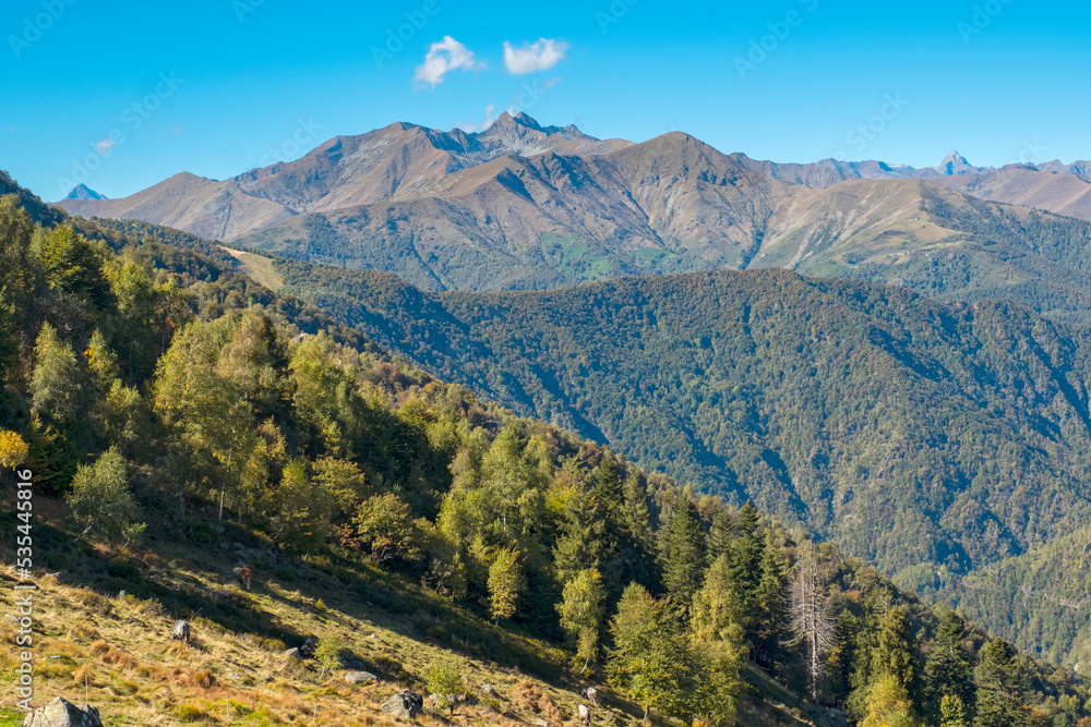 Fototapeta premium Early fall panorama of the Panoramica Zegna mountains. Is a touristic viewpoint, located in Piedmont Region (Northern Italy), Biella Province, overlooking the Po Valley.