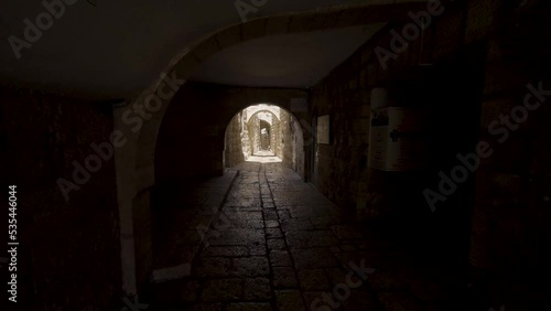 Walking Through Dark Tunnel Archway At Western Wall In The Old City of Jerusalem In Israel. - POV, dolly forward