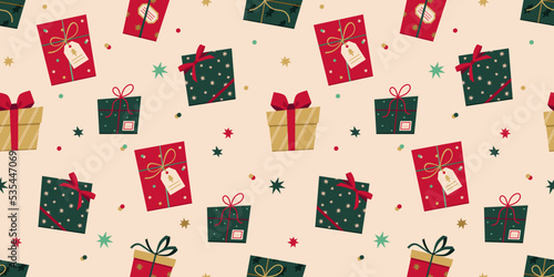 Vector seamless pattern with gift boxes in flat style. Christmas stylish background of presents, bows, stars and confetti. New Year pattern for wrapping paper, textile, presents, etc. 
