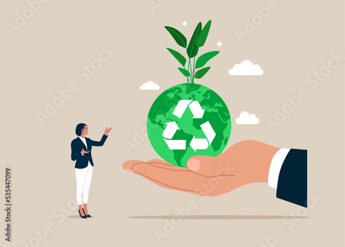 Hand holding sustainable green world with recycle symbol. Renewable energy to save the world from climate change or global warming. Flat vector illustration.