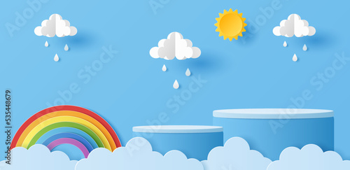 Paper cut of cylinder podium for products display presentation with sun, clouds, raindrops and rainbow. Vector illustration photo
