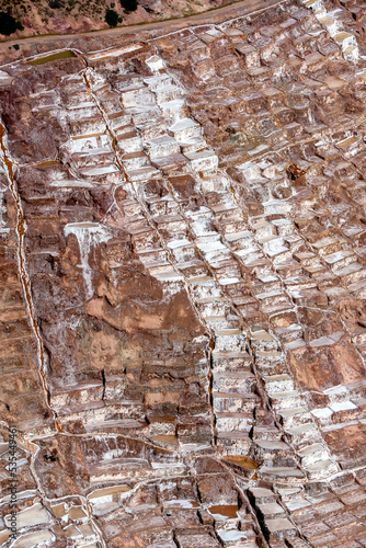 The Maras salt evaporation ponds located in the Sacred Valley of the Incas in Peru. The ponds have been in use since the days of the Incas.