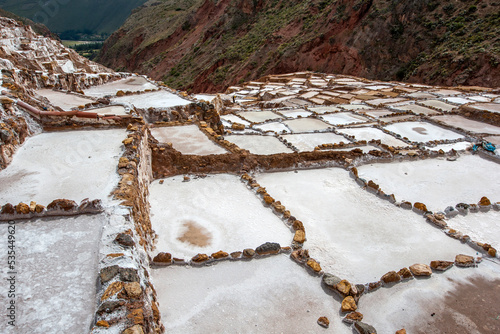 Fototapeta The Maras salt evaporation ponds located in the Sacred Valley of the Incas in Peru