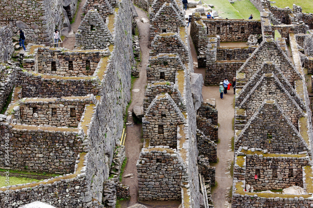 The ancient ruins of residential houses at Machu Picchu which is a 15th ...