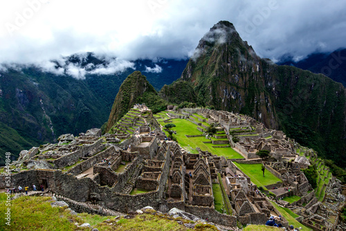 The ancient ruins of residential houses at Machu Picchu which is a 15th-century Inca site located 2,430m above sea level in the Sacred Valley of the Incas in Peru Fototapet