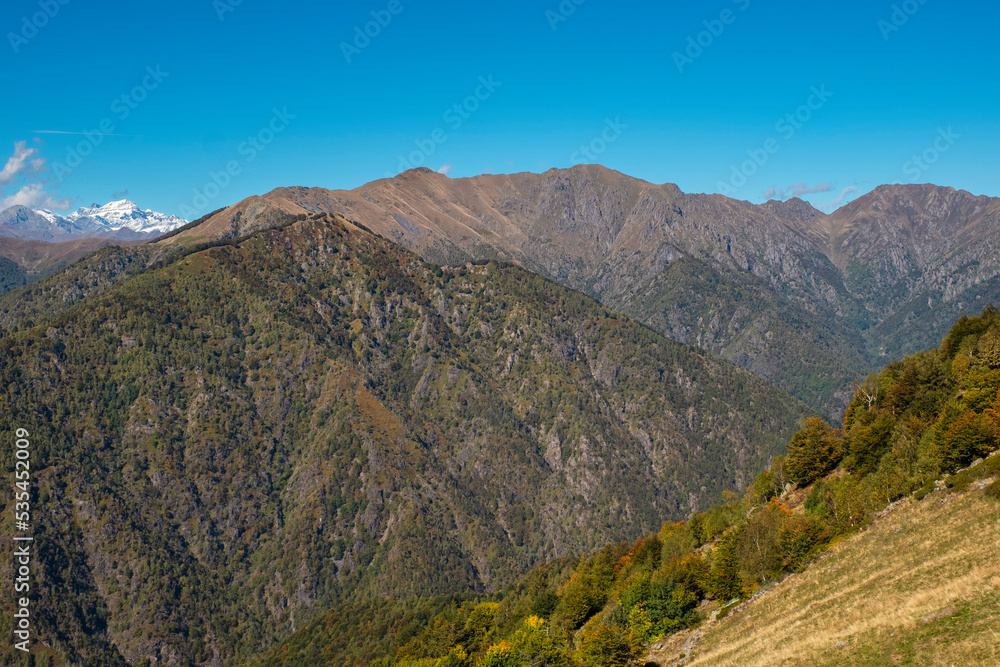Fototapeta premium Early fall panorama of the Panoramica Zegna mountains. Is a touristic viewpoint, located in Piedmont Region (Northern Italy), Biella Province, overlooking the Po Valley.