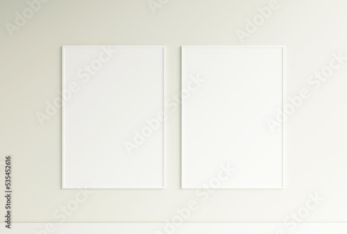 Clean and minimalist front view vertical white photo or poster frame mockup hanging on the wall. 3d rendering.