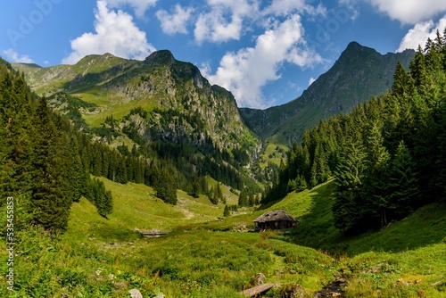 Scenic view of Valea rea mountain range and green valley photo