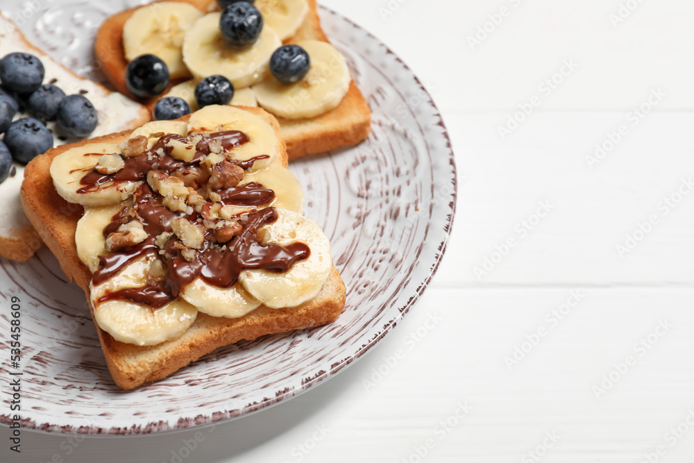 Different sweet delicious toasts on plate, closeup Different sweet delicious toasts on plate, closeup