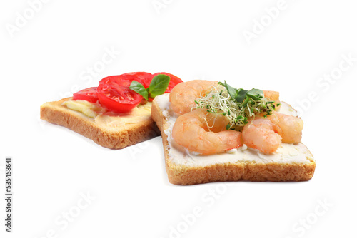 Delicious toasts with different toppings isolated on white