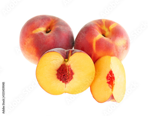 Whole and cut ripe peaches isolated on white