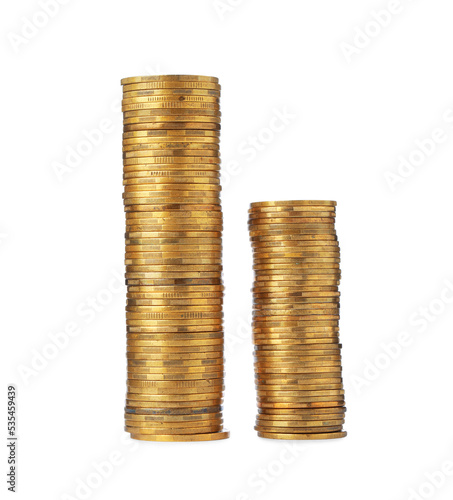 Stacks of golden coins on white background