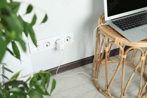 Schilderij op canvas Electric power outlet sockets with charger on white wall