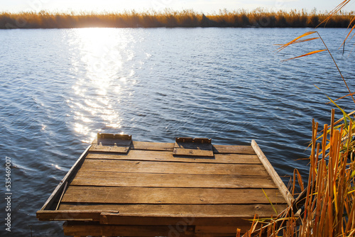 Wooden pier near river on s...
