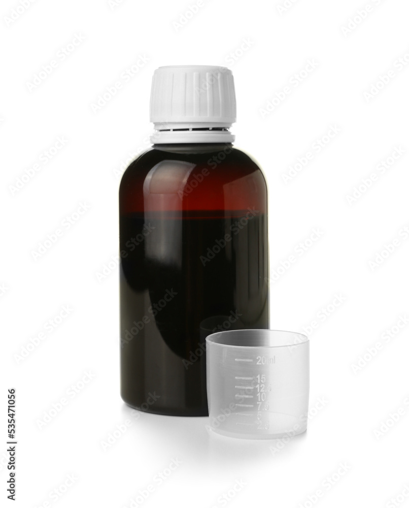 Fototapeta premium Bottle of cough syrup and cup on white background