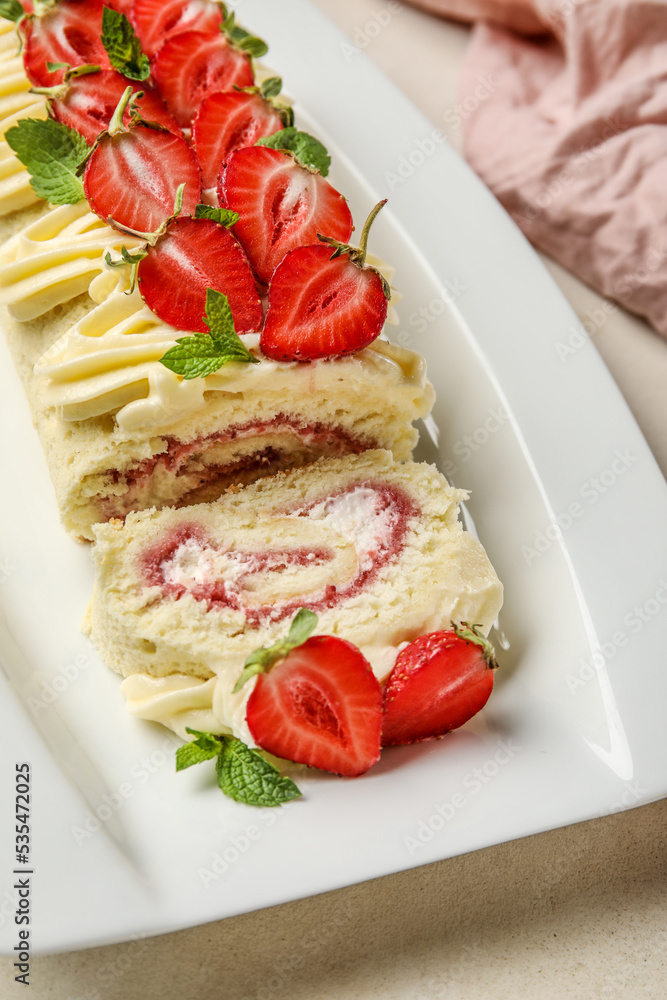 Plate with delicious strawberry roll cake on table, closeup Plate with delicious strawberry roll cake on table, closeup