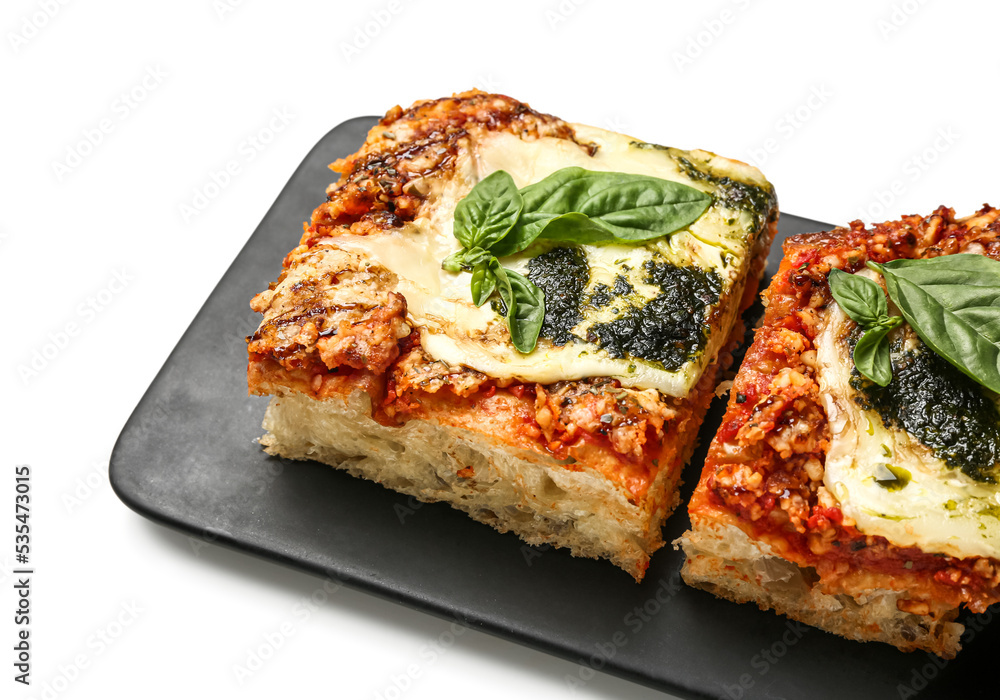 Board with tasty Italian pie with mozzarella and pesto sauce on white background, closeup Board with tasty Italian pie with mozzarella and pesto sauce on white background, closeup