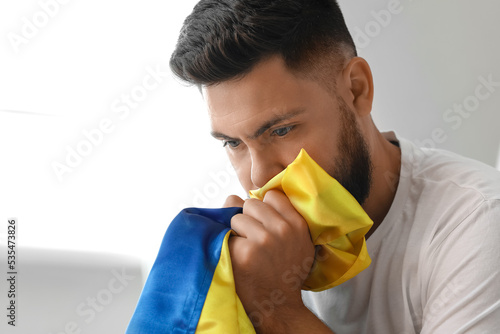 Young man with flag of Ukra...
