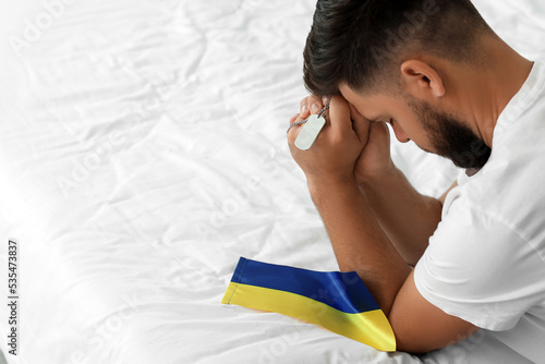 Young man with flag of Ukra...