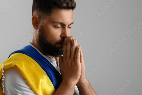 Young man with flag of Ukra...