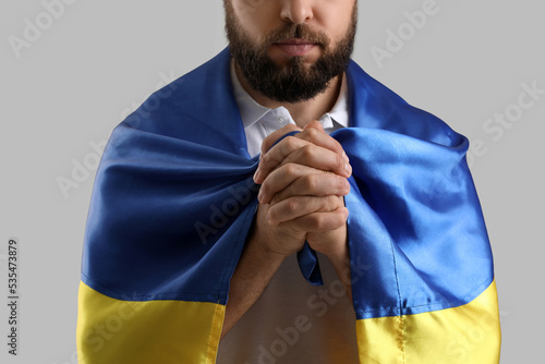 Young man with flag of Ukra...