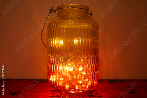 glass bottle lit with warm colors