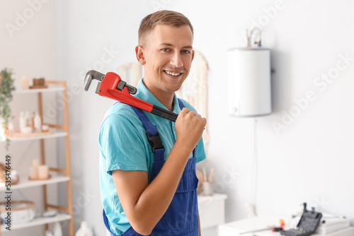 Male plumber with pipe wren...