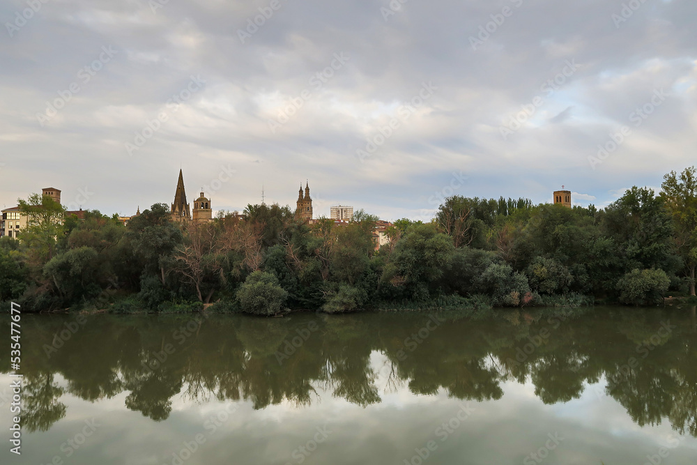 Ebro river, riverbank vegetation and city of Logroño, La Rioja, Spain.