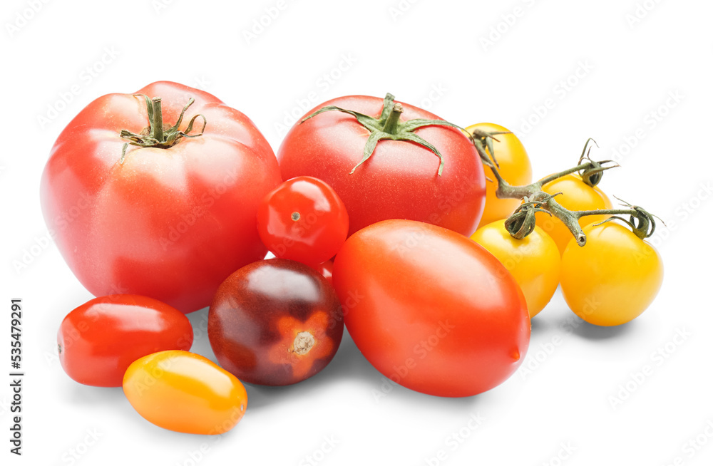 Heap of fresh different tomatoes on white background Heap of fresh different tomatoes on white background