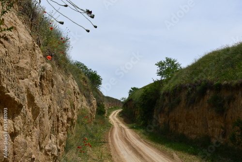 Dusty road through hills 