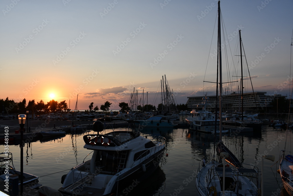 Sunset  photo of yacht port on sea