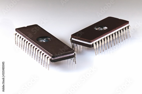 Closeup shot of two EEPROM memory chip on a white background photo