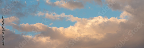 Fototapeta Naklejka Na Ścianę i Meble -  Beautiful sunset sky background with clouds. Scenic cloudscape. Wide panoramic background for design.