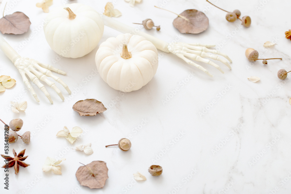 Fototapeta premium white halloween pumpkins with decor on marble background