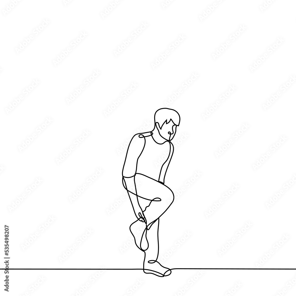 man stands on one leg adjusting his toe on his leg - one line drawing vector. concept to adjust the sock on the go