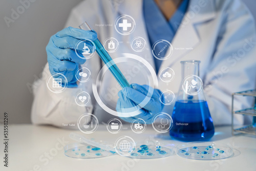 Science and medicine, scientist analyzing and dropping a sample into a glassware, experiments containing chemical liquid in laboratory on glassware, innovative and technology.