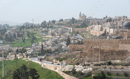 View from above over Jerusalem fortress and wall with the cemetery from Mount of Olives in foreground. Landmark landscape view of this city from Israel. © Dragoș Asaftei