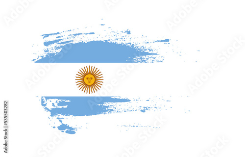 Grunge brush stroke flag of Argentina with painted brush splatter effect on solid background