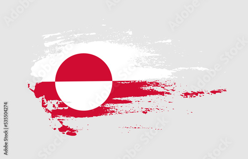 Grunge brush stroke flag of Greenland with painted brush splatter effect on solid background
