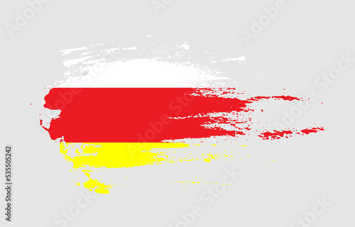 Grunge brush stroke flag of North Ossetia with painted brush splatter effect on solid background