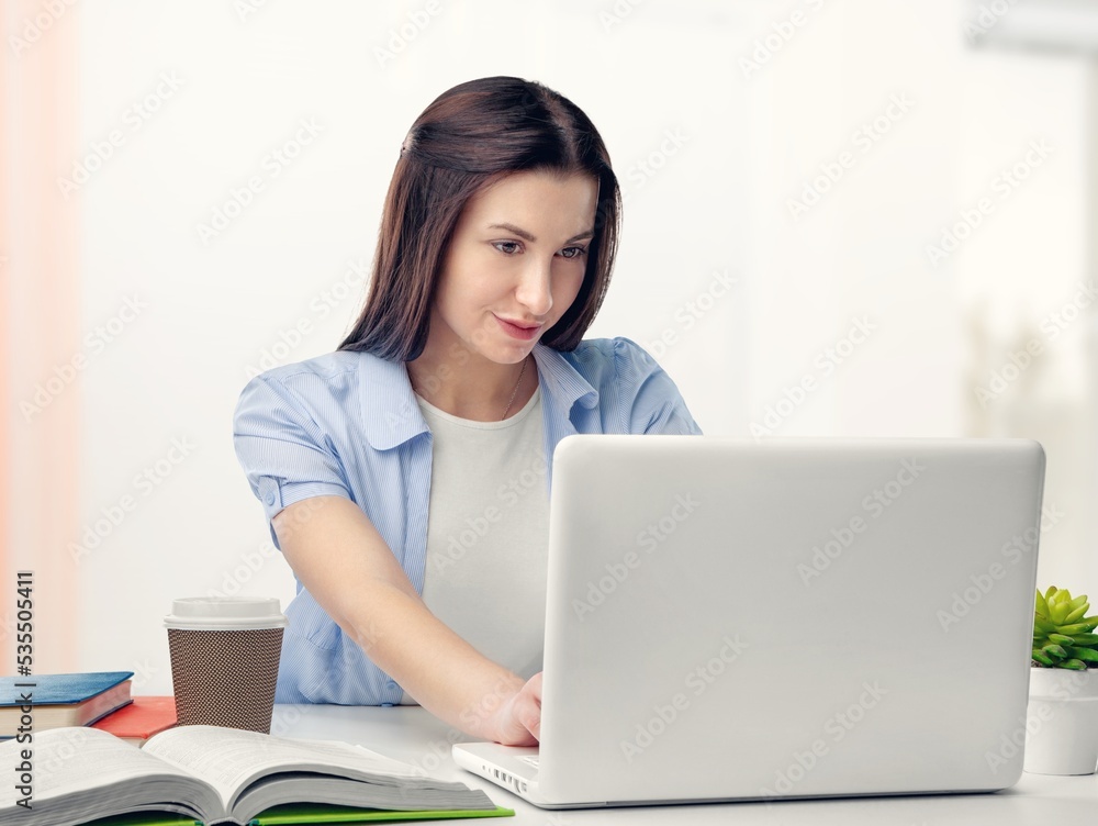 Young business woman work on computer at office Young business woman work on computer at office