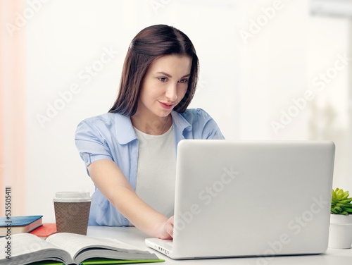 Young business woman work on computer at office © BillionPhotos.com