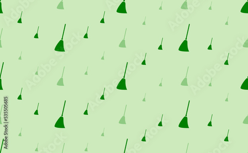 Seamless pattern of large and small green broom symbols. The elements are arranged in a wavy. Vector illustration on light green background