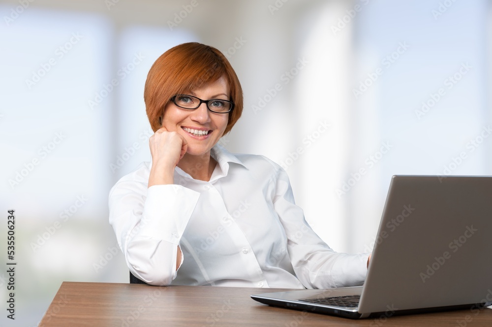 Young business woman work on computer at office Young business woman work on computer at office